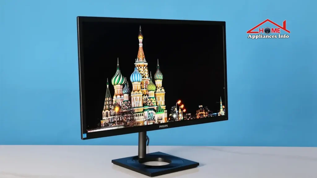 Philips 27E1N8900 4K OLED monitor on a professional workstation